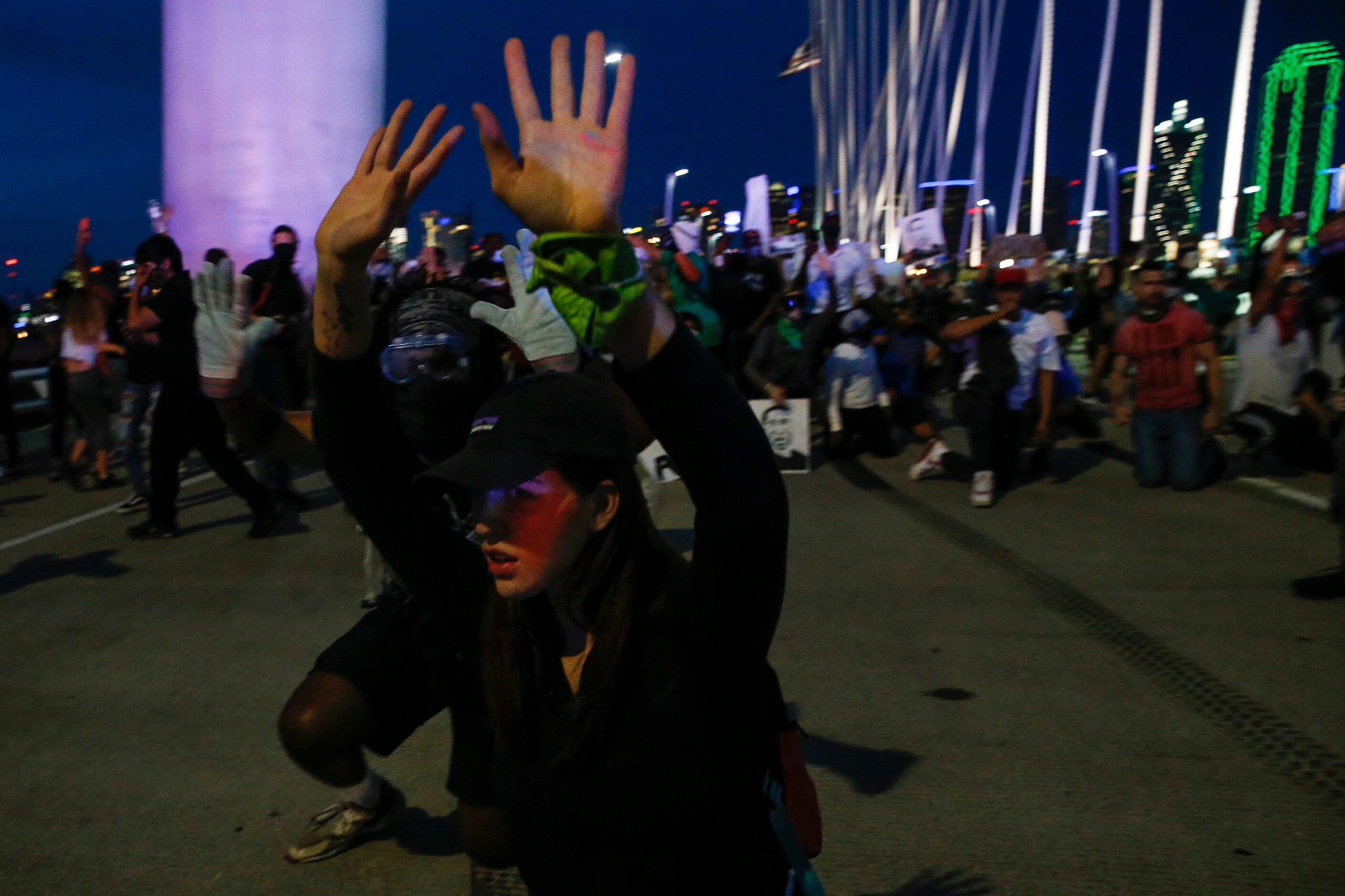 Protesters march onto the Margaret Hunt Hill Bridge as the demonstrate against police...