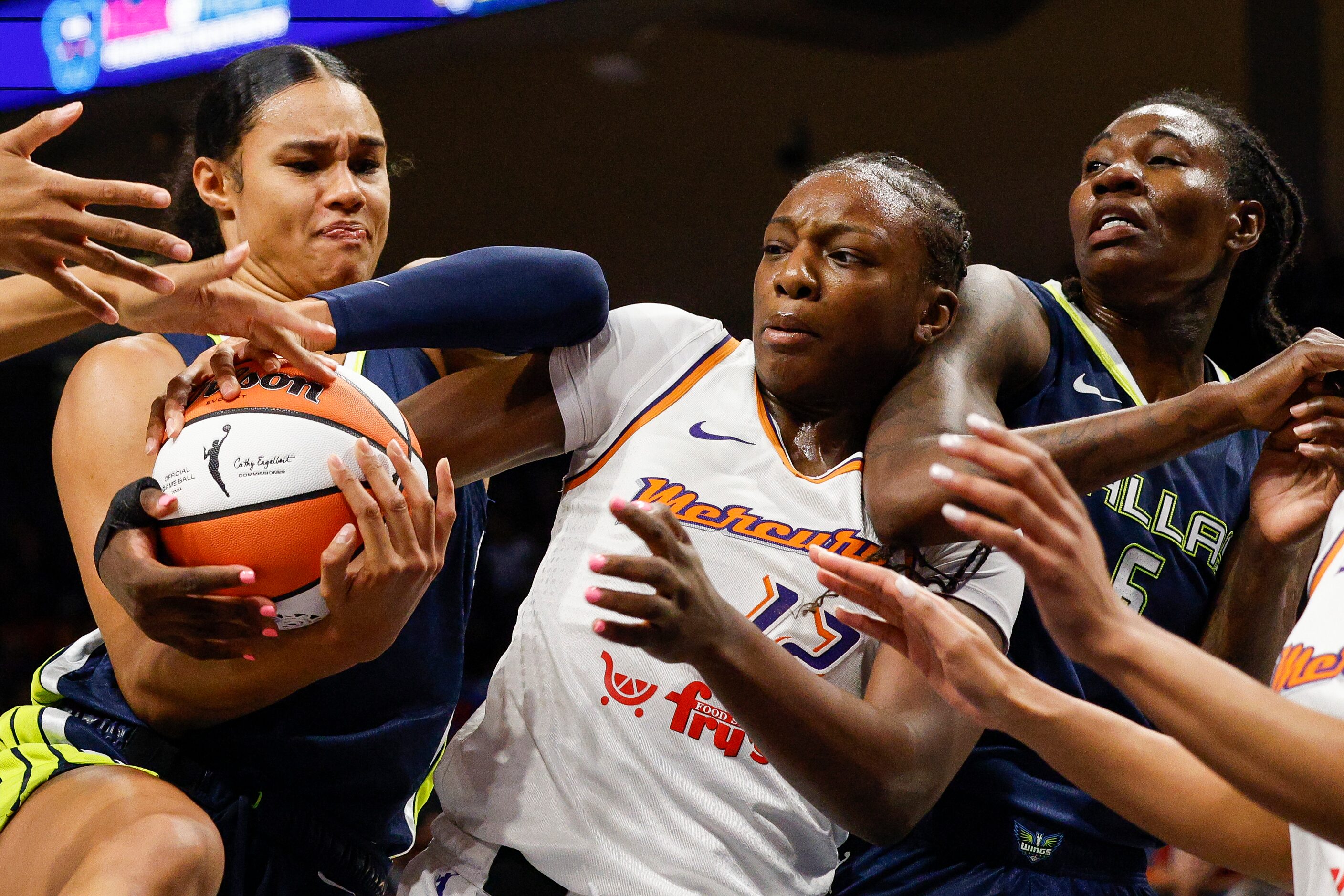 Dallas Wings forward Satou Sabally (left) and Phoenix Mercury forward Michaela Onyenwere...