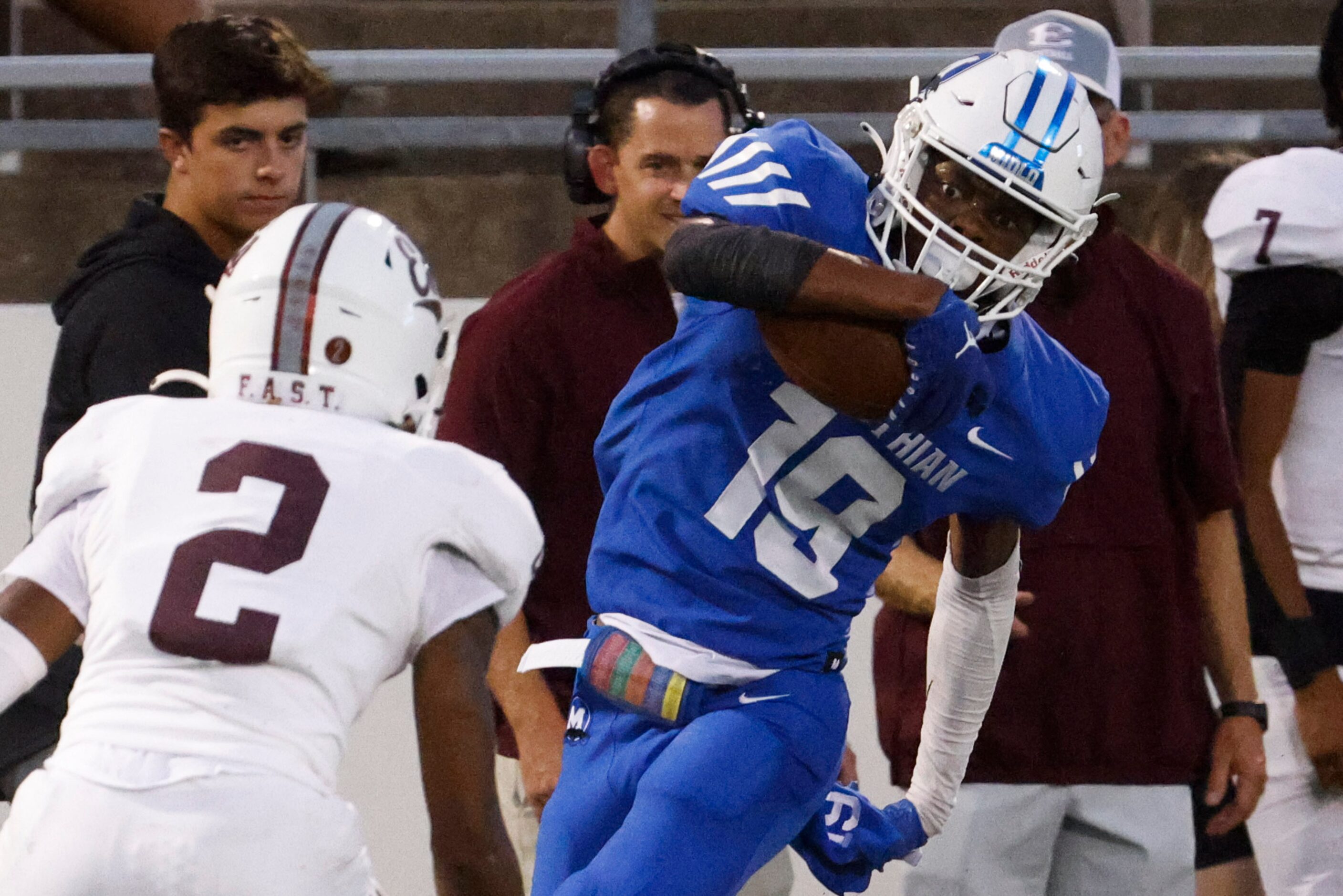 Midlothian’s Bryant Wesco (19) gets tackled as he runs for a yardage against Ennis high...