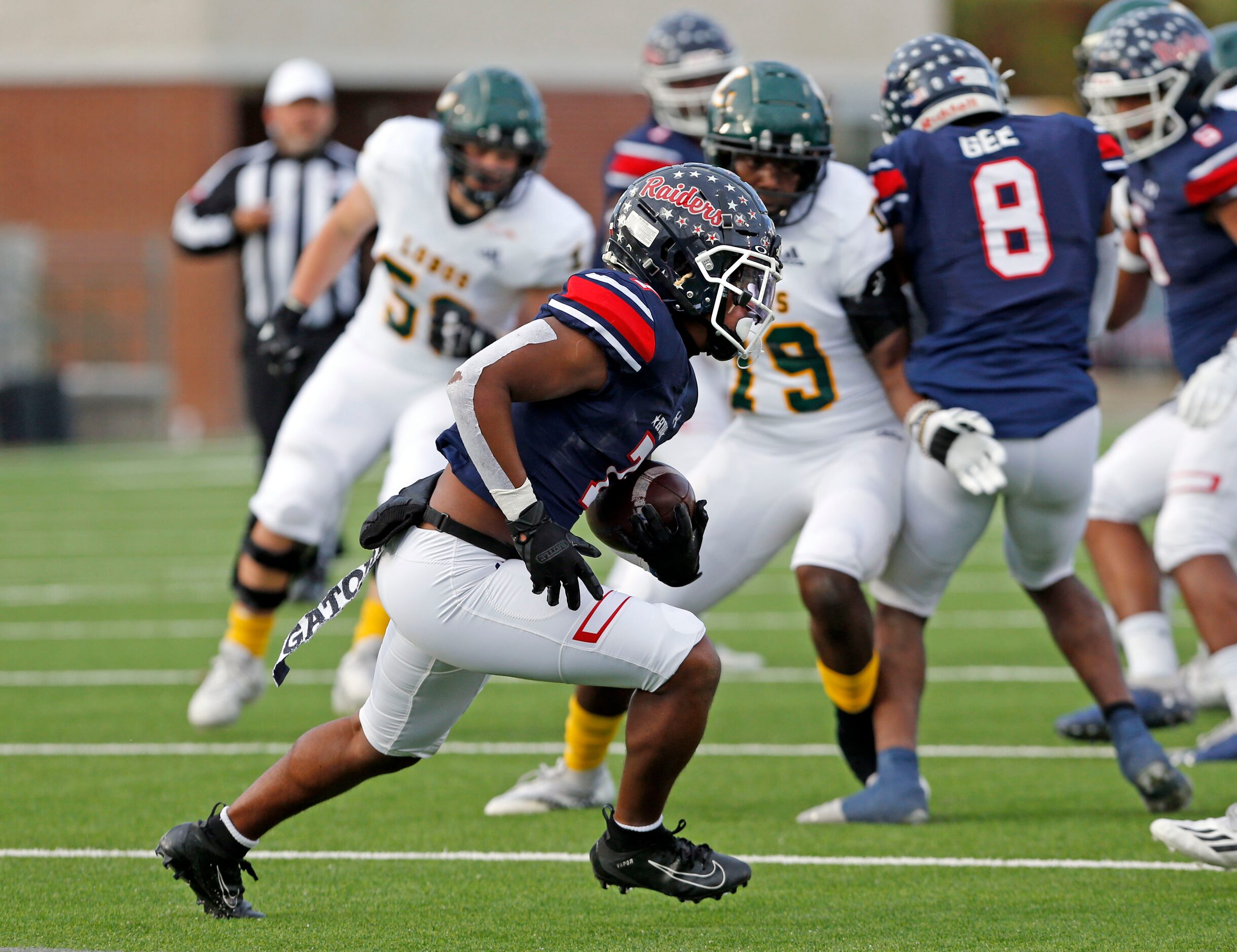 Denton Ryan DB Garyreon Robinson (7) returns an interception in heavy traffic during the...