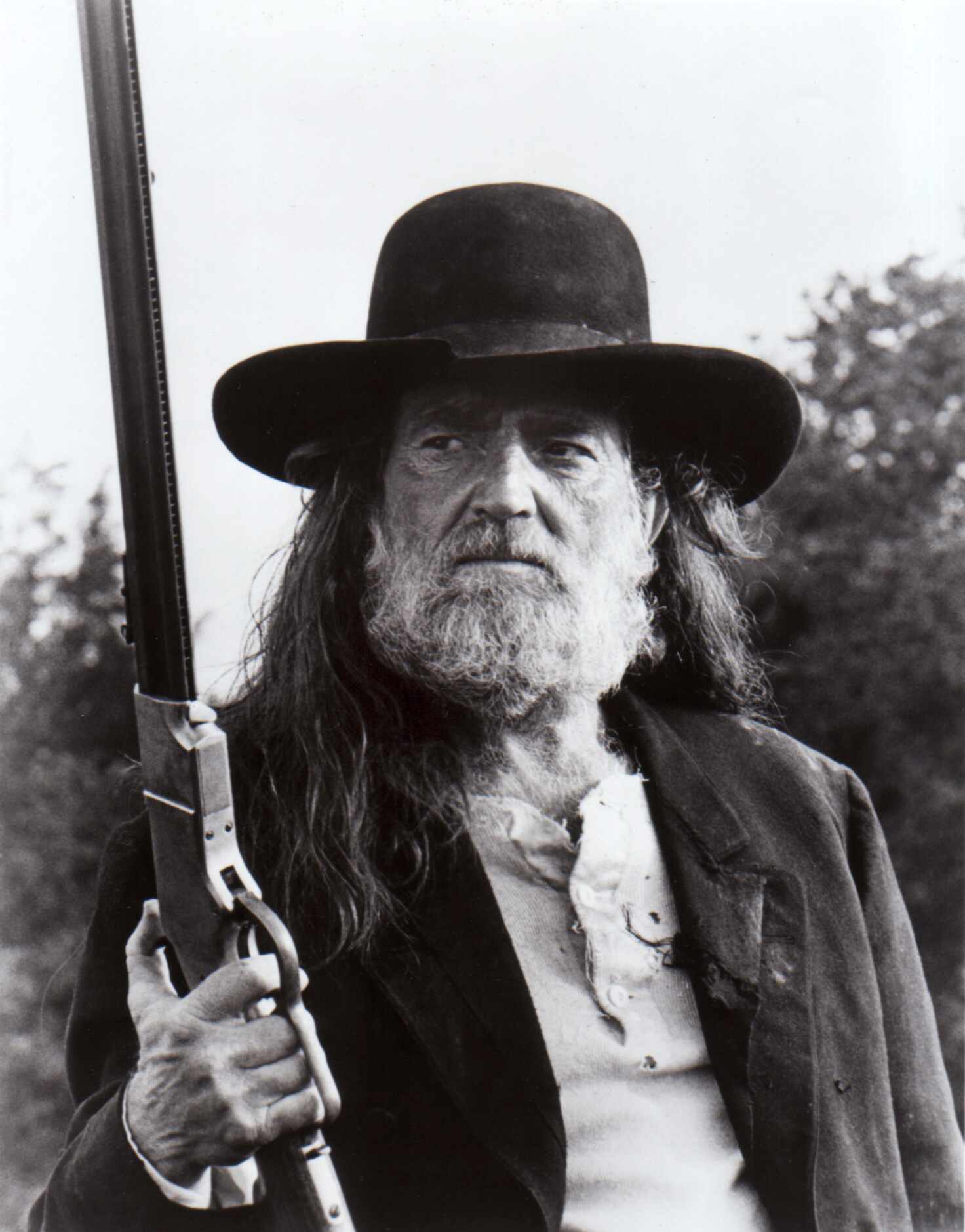 1986 - Willie Nelson, shown in the making of the film version of "Red Headed Stranger,"...