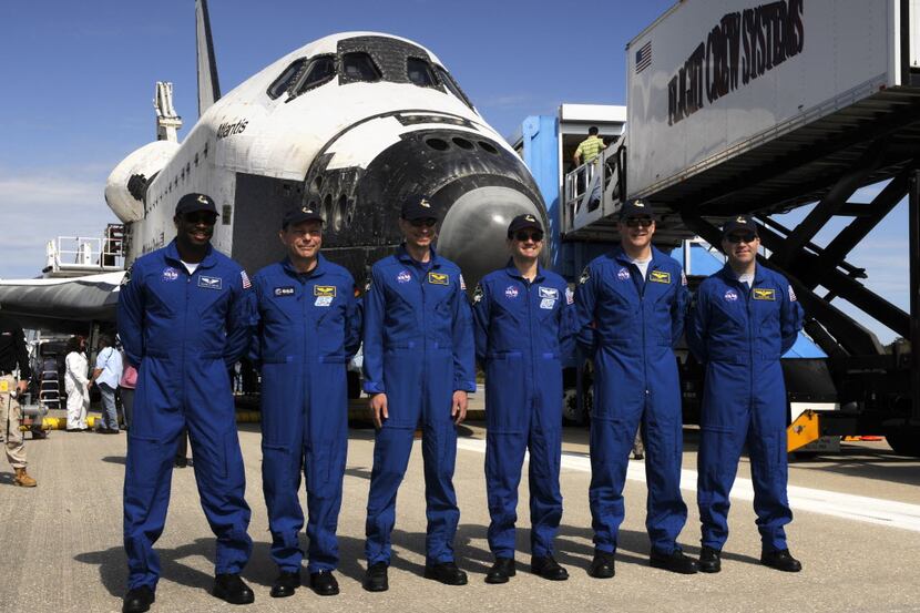 ORG XMIT: *S0422416031* This NASA handout photo shows the crew of the space shuttle Atlantis...
