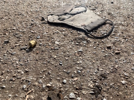 A single bullet casing lay on the street two houses down from where Crystal Rodriguez was...