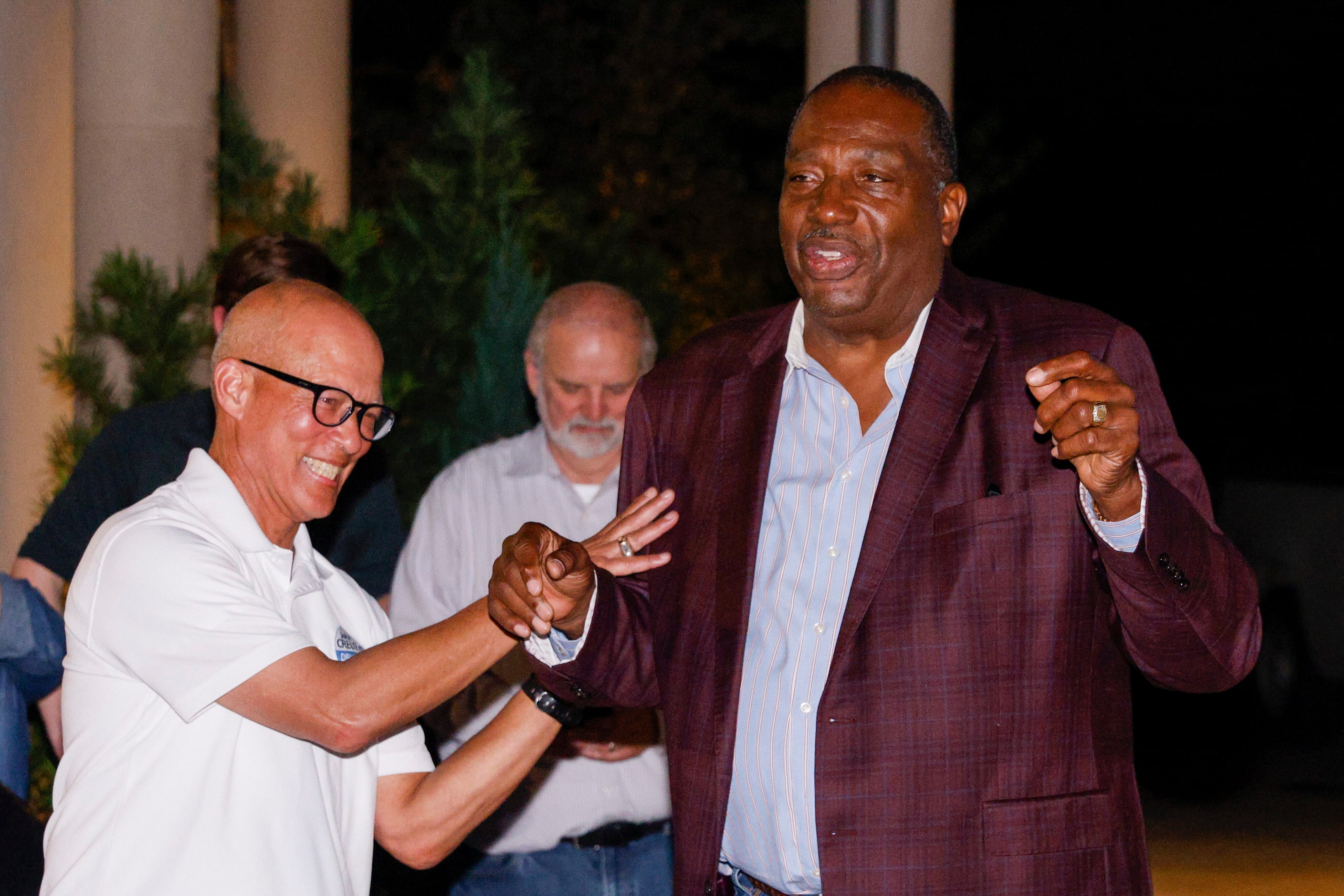 Dallas County District Attorney John Creuzot, a Democrat (left), laughs with State Sen....