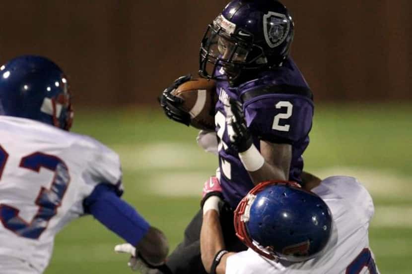 
Lincoln running back Derrick Neal (2) has committed to playing football at the University...