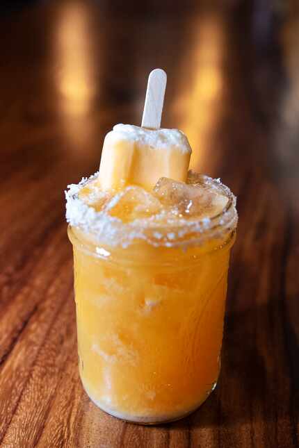 The drink menu at Whiskey Hatchet includes The American Dream (sicle), a $10 cocktail with...