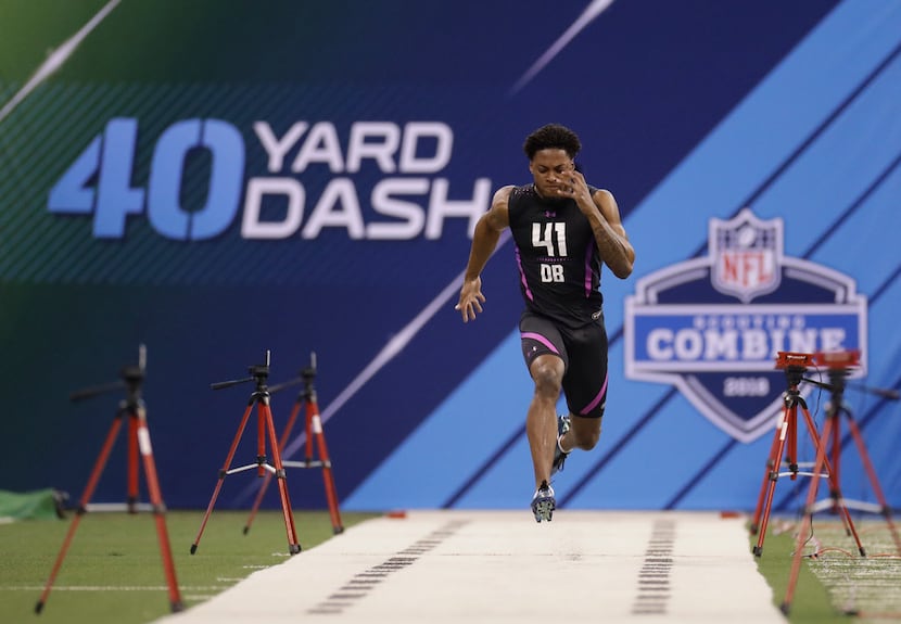 Ohio State defensive back Denzel Ward runs the 40-yard dash during the NFL football scouting...