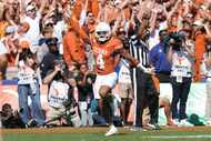 Texas defensive back Austin Jordan (4) celebrates scoring a touchdown after recovering a...
