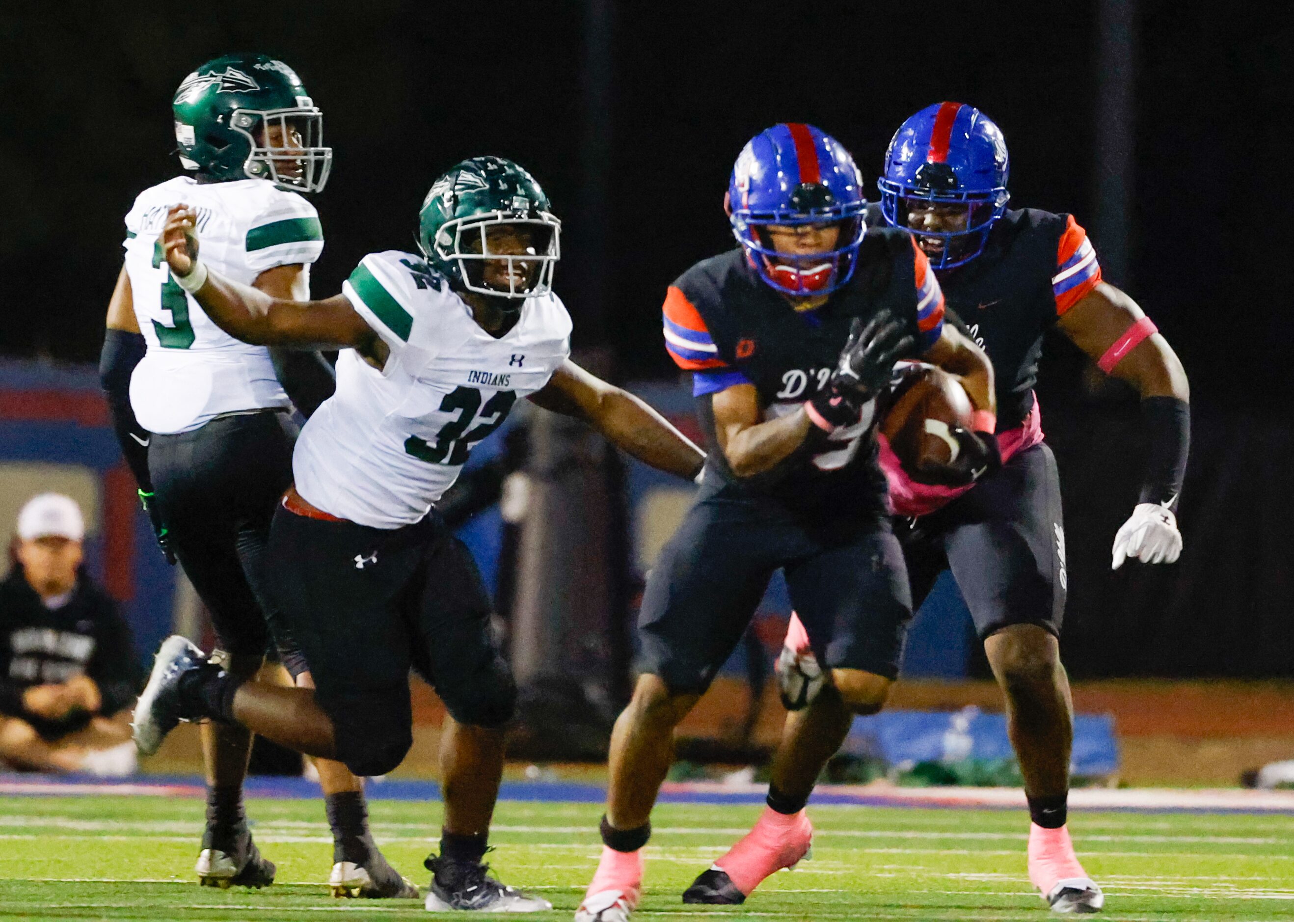 Duncanville running back Caden Durham (29) breaks free from Waxahachie line backer La’Markus...