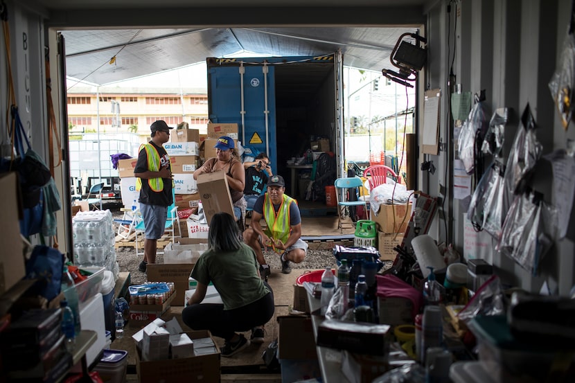 Volunteers organize donated items at Puuhonua o Puna, a community organization serving...