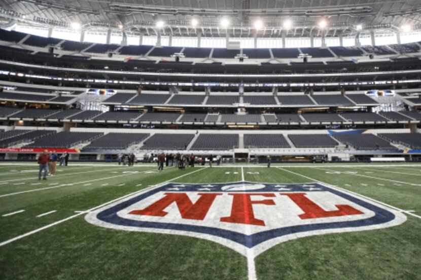 The NFL logo, painted at mid field on January  27,  2011 at Cowboys Stadium in Arlington.