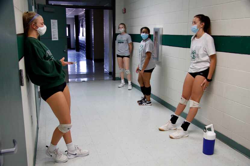 Kennedale volleyball players wait for practice to start Monday. (Steve Hamm/ Special...