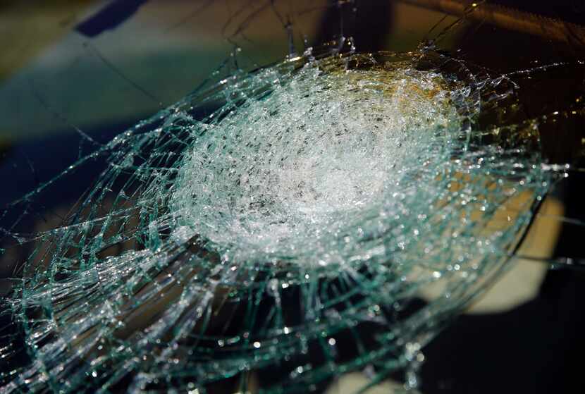 Hail damage left a giant spiderweb crack on the windshield of a car in Coppell on Wednesday.