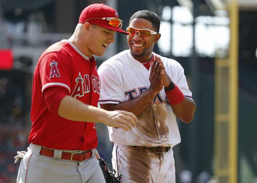 Texas Rangers shortstop Elvis Andrus (1) shares a laugh with Los Angeles Angels center...