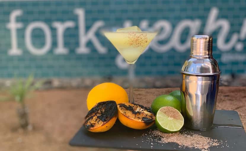 Fork and Fire's Tequila-Tini margarita features grilled oranges, fresh lime, agave and a...