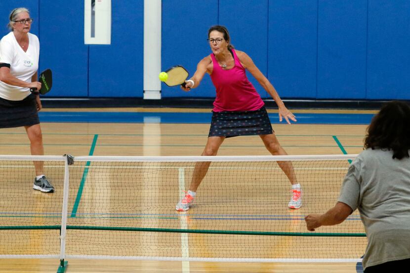 Pickleball players volley during a game at Ridgewood-Belcher Recreation Center in Dallas in...