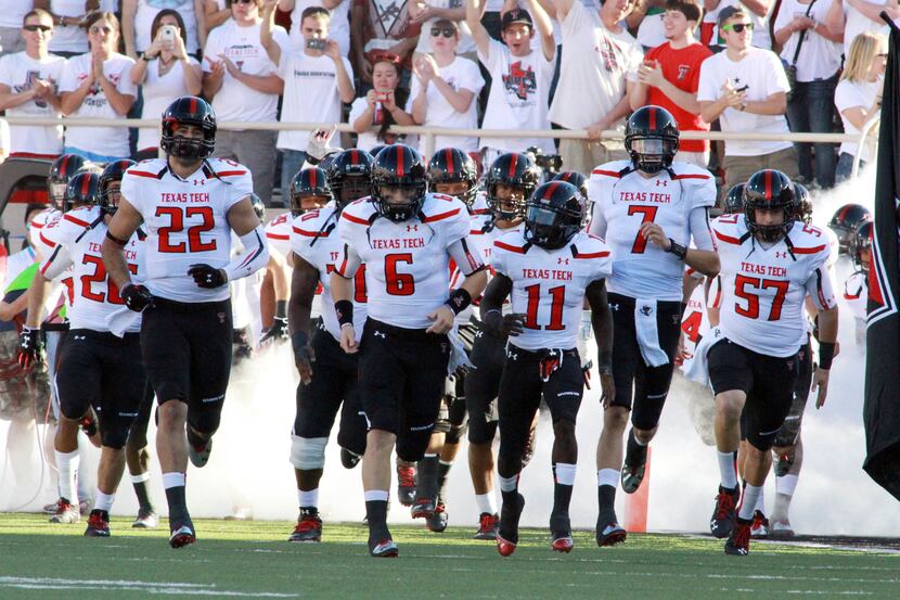Sep 21, 2013; Lubbock, TX, USA; Texas Tech Red Raiders enter the field for the game against...