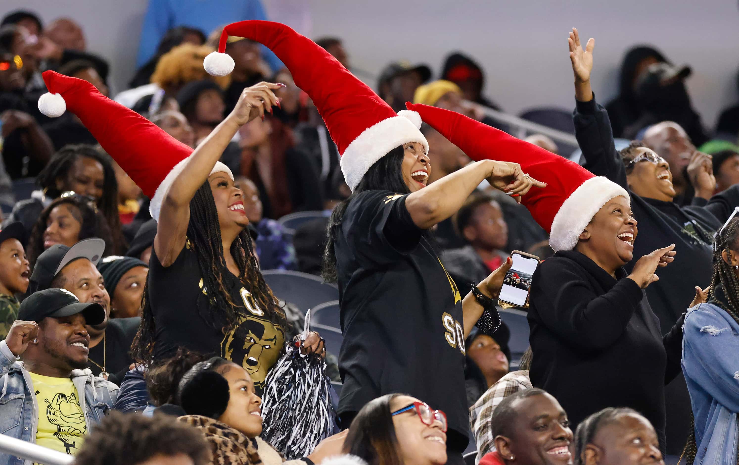 South Oak Cliff fans donned Santa hats as they cheered during the Class 5A Division II state...