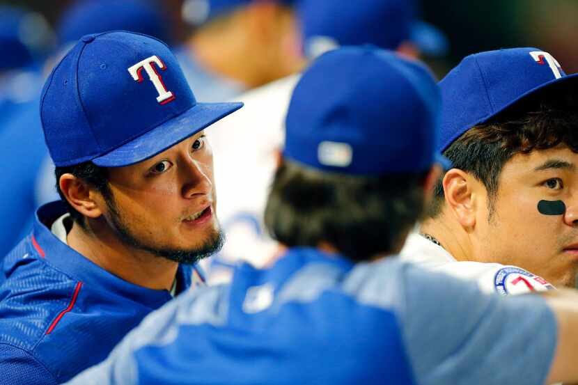 Texas Rangers starting pitcher Yu Darvish (left) came back out for the ninth inning as he...