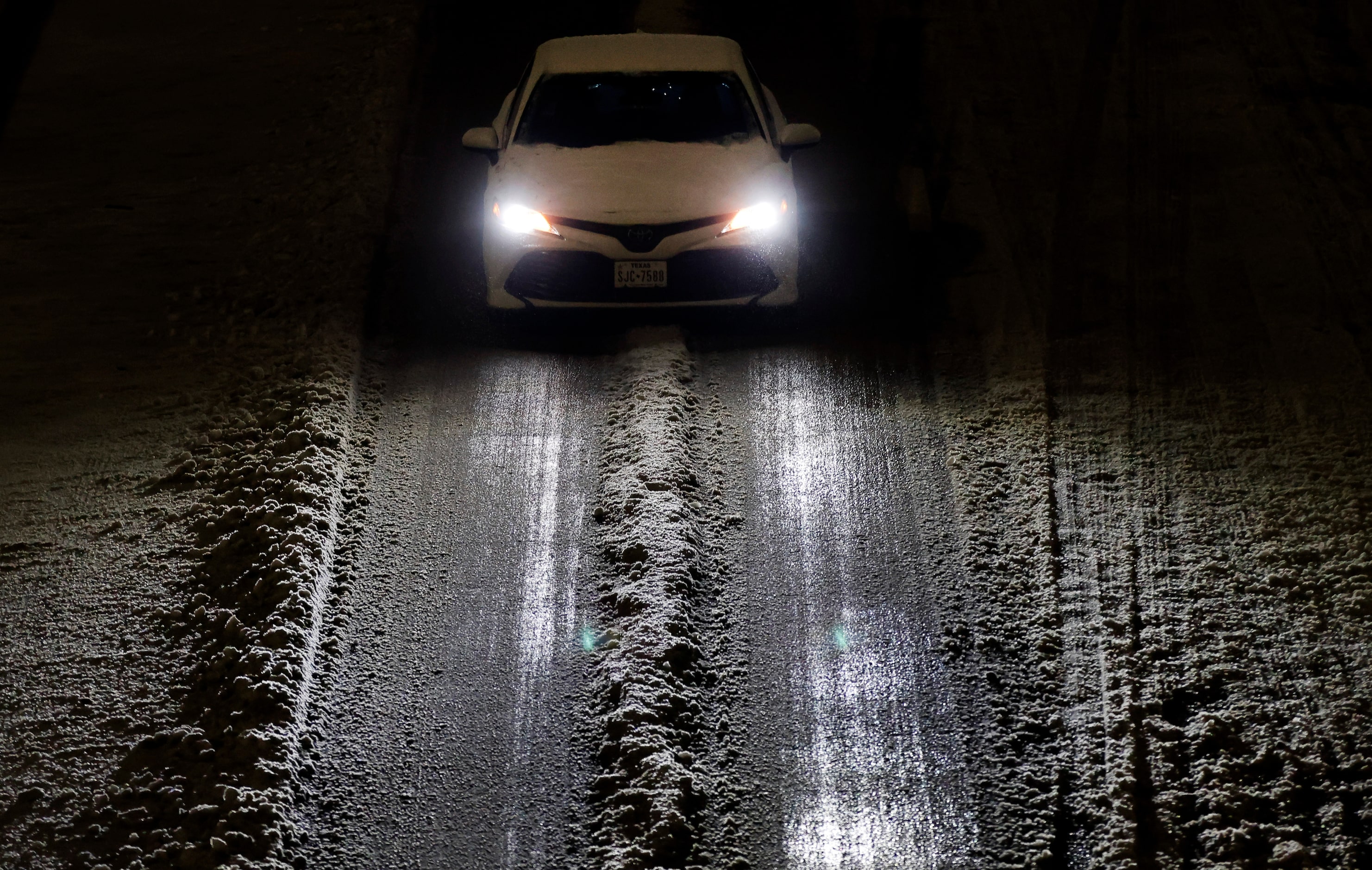 Traffic created a main pathway through the sleet on westbound Interstate 30 during what...