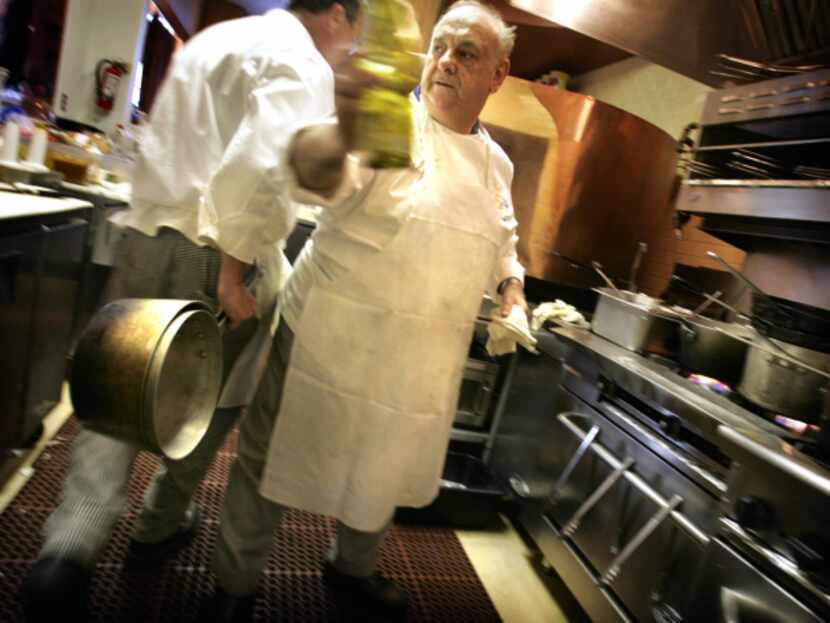 Executive chef Jean LaFont (right) and chef Mark Moberly cross paths in the kitchen of...