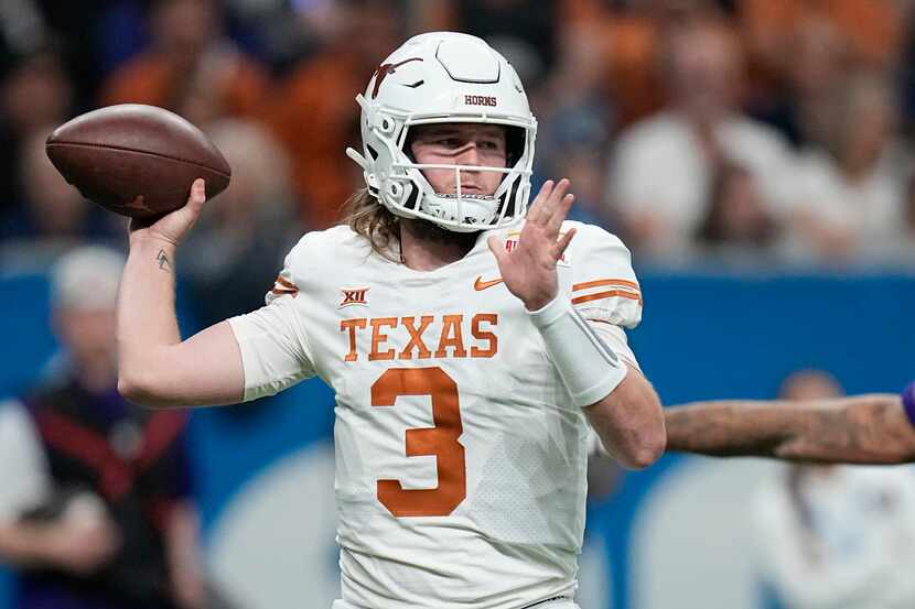 FILE - Texas quarterback Quinn Ewers (3) looks to pass against Washington during the second...