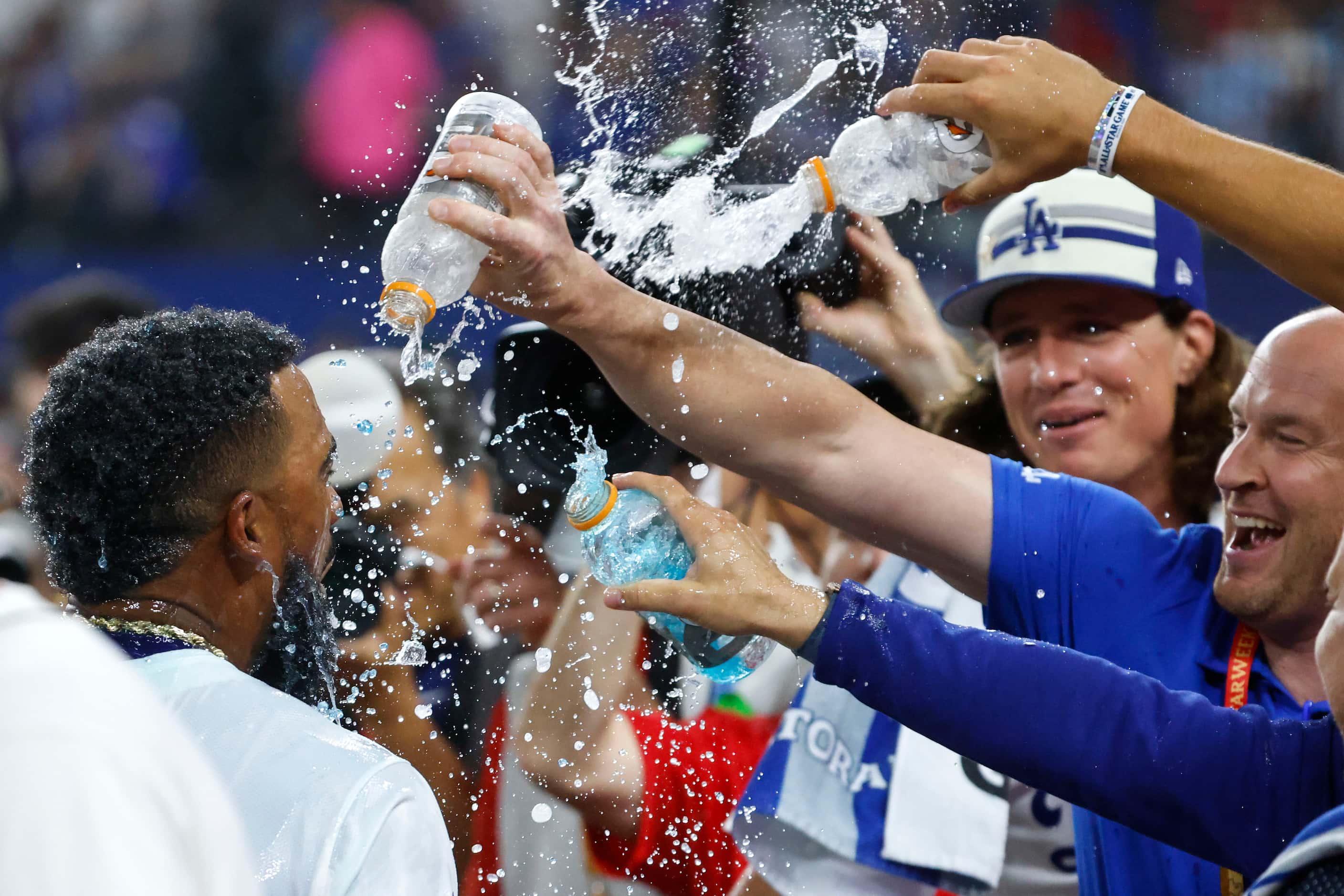 National League's Teoscar Hernández, of the Los Angeles Dodgers, celebrates after winning...