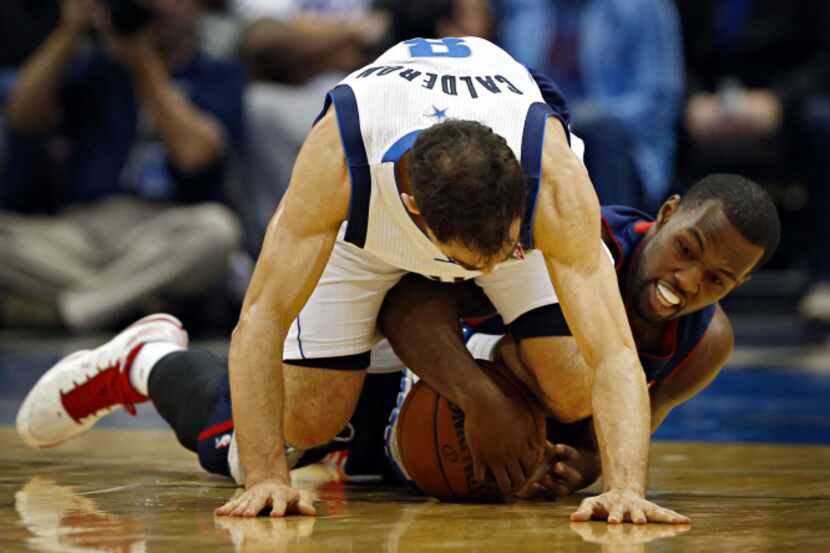 Dallas Mavericks point guard Jose Calderon and Detroit Pistons shooting guard Rodney Stuckey...