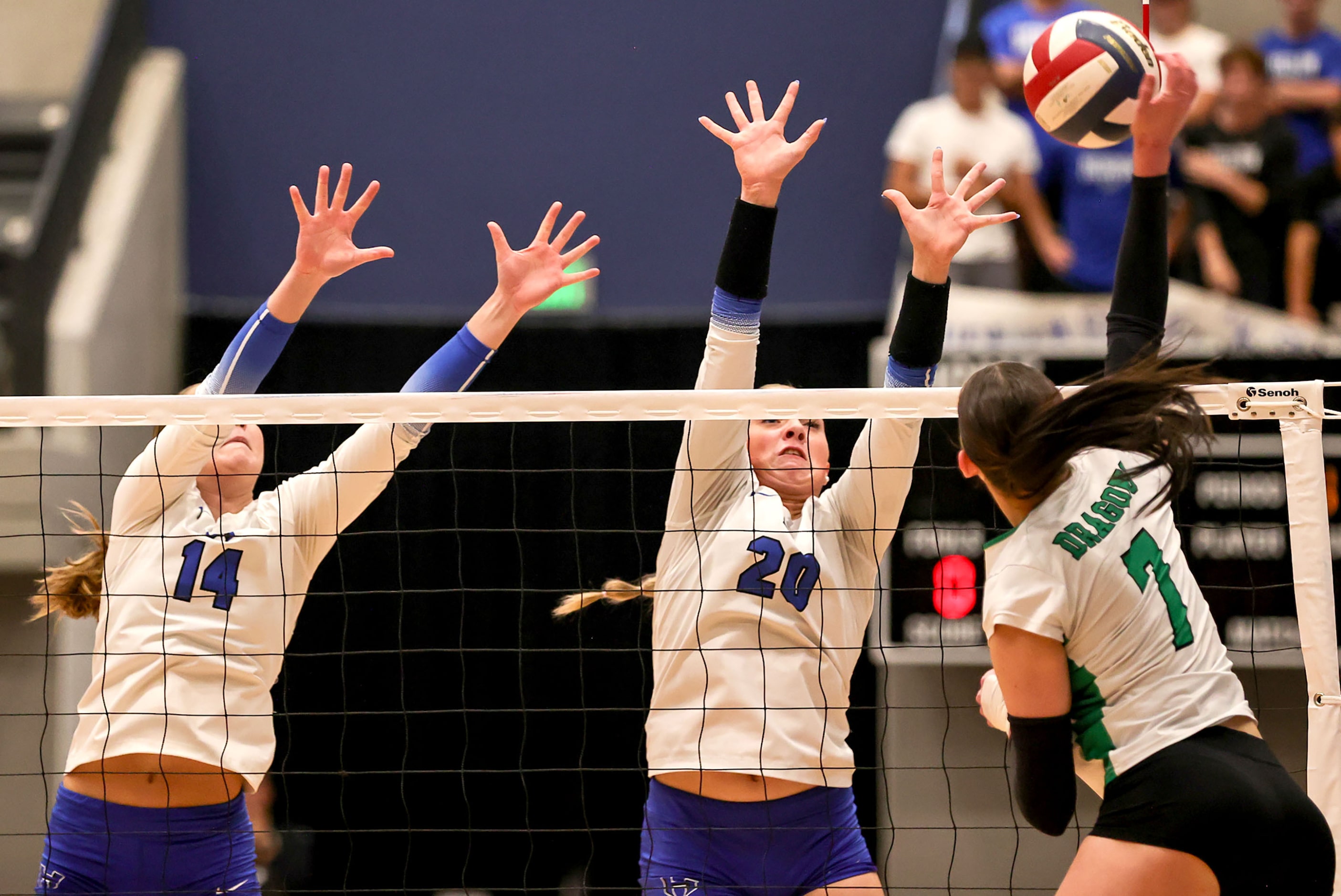 Southlake Carroll's Regan McCullough (7) attempts a kill against Hebron's Addison Vary (20)...