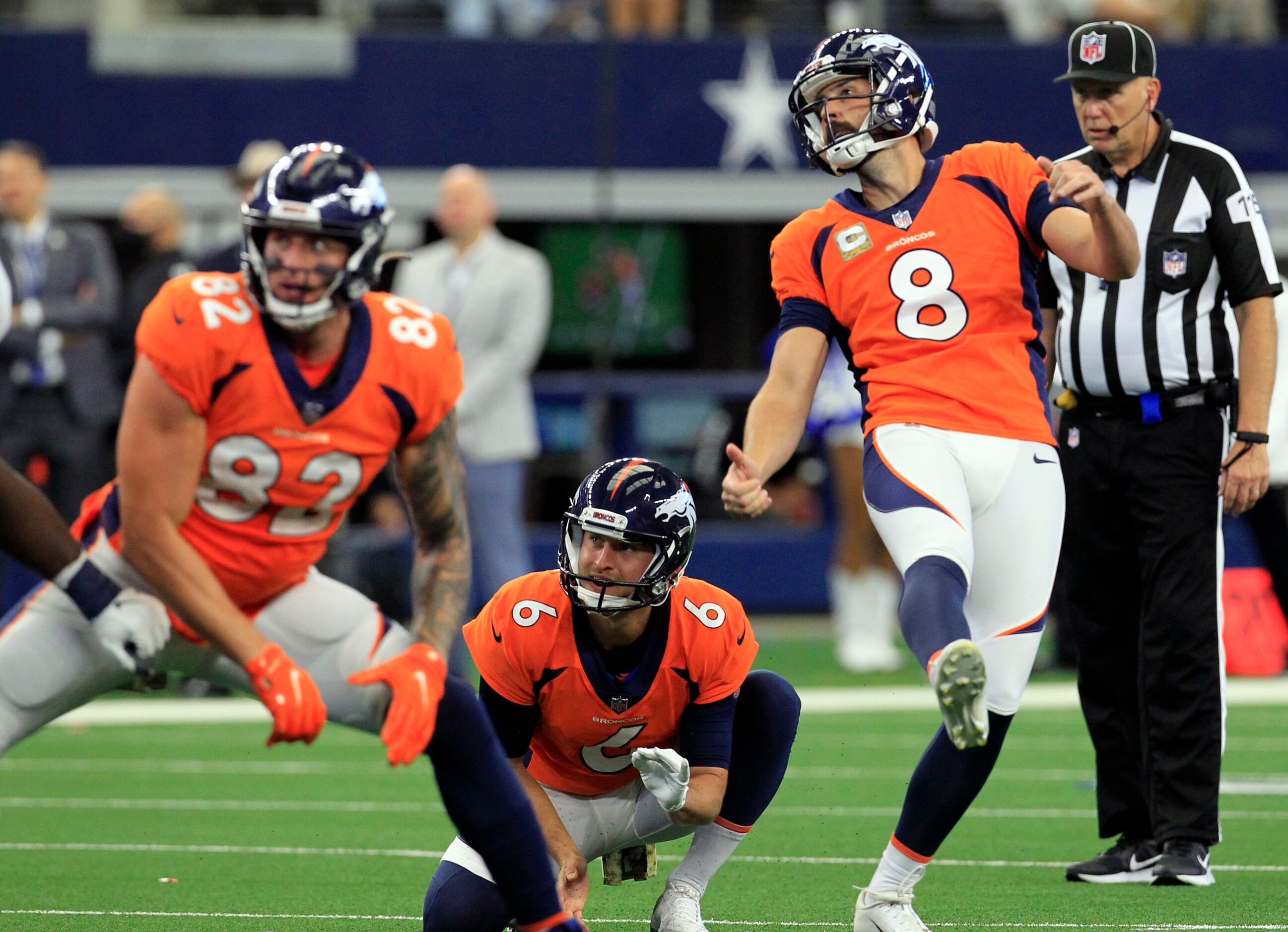 Denver Broncos kicker Brandon McManus (8), holder Sam Martin (6) and end Dre'Mont Jones (93)...