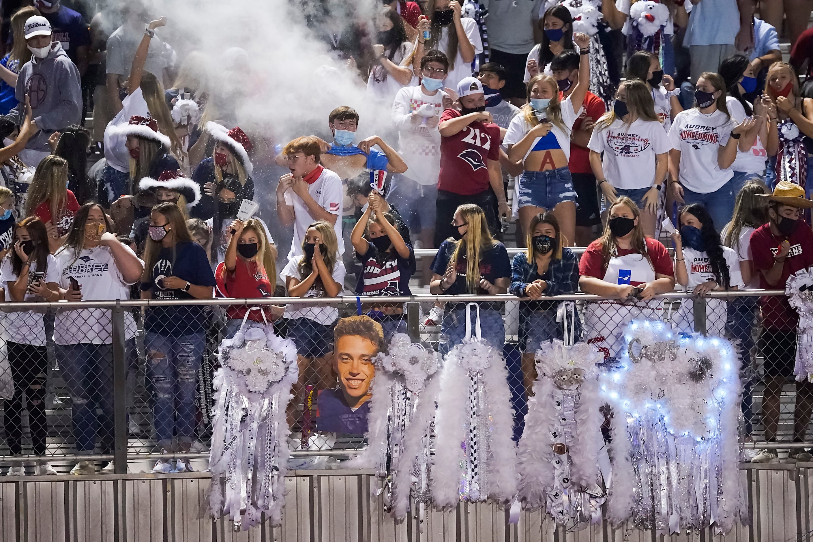 Aubrey fans celebrate a Chaparrals touchdown during a high school football game against...