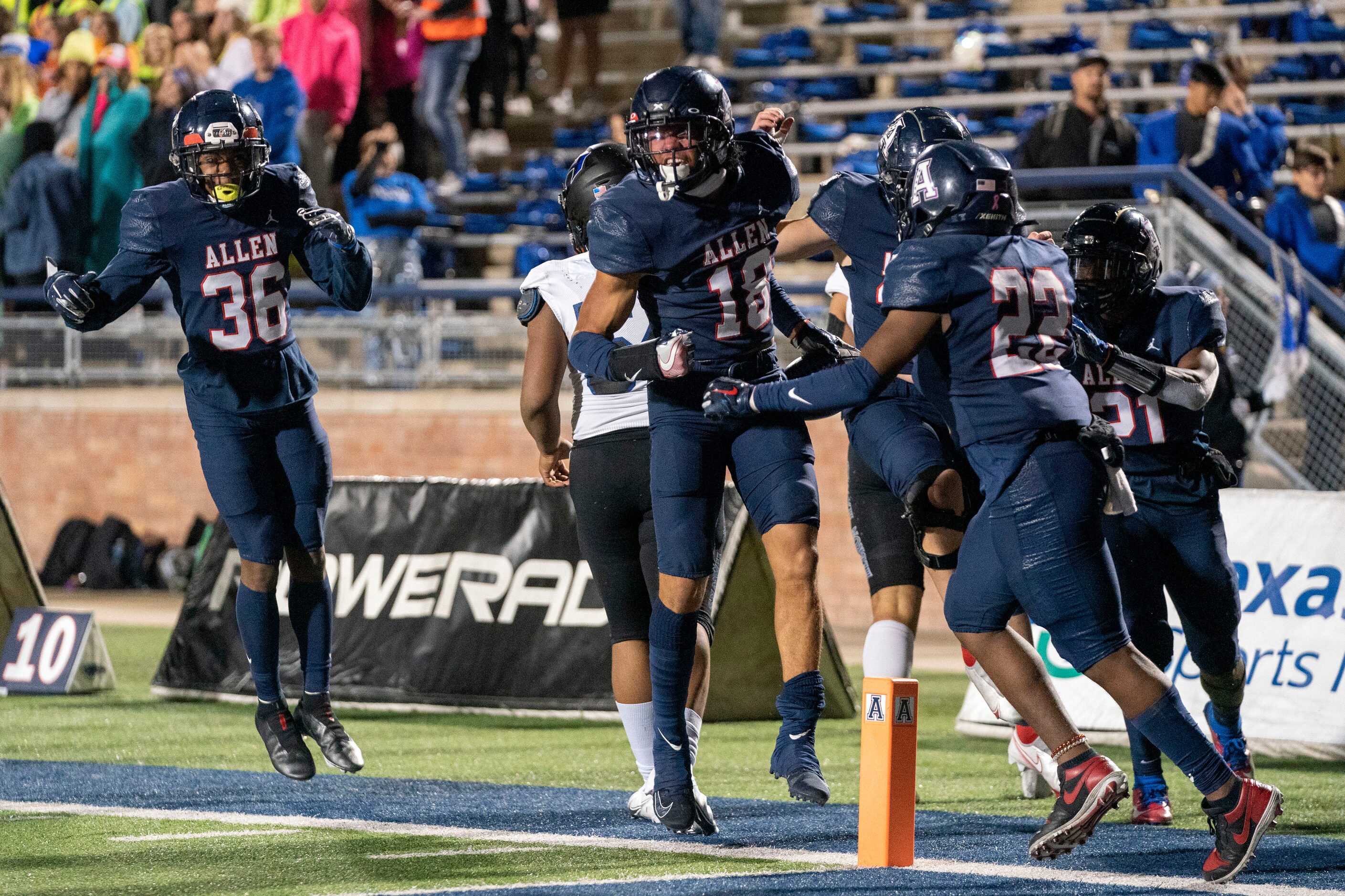 Allen junior defensive back Malakai Thornton (18) celebrates with teammates after returning...