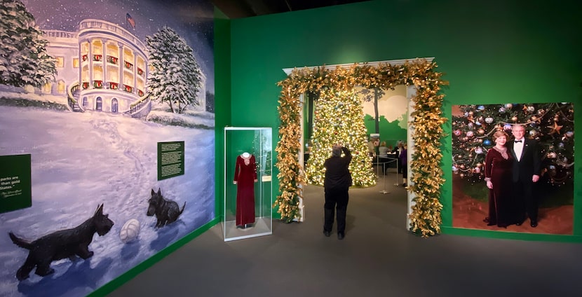 A visitor photographs an 18-foot replica of the official White House Blue Room Christmas...