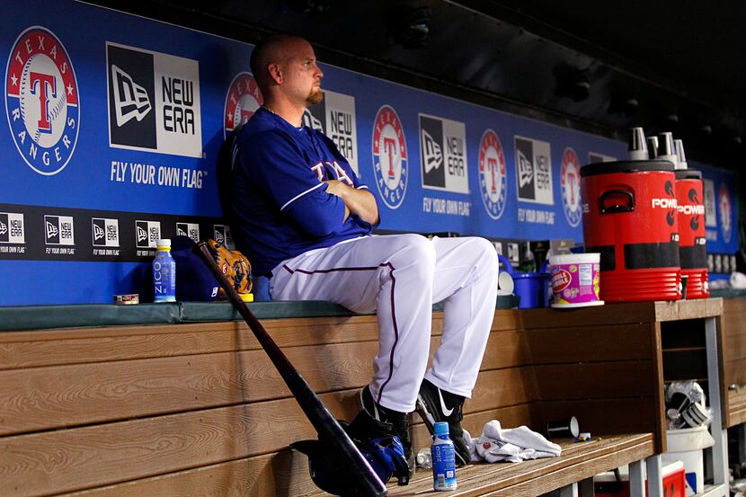 Texas Rangers relief pitcher Kyle McClellan sits with his thoughts after all the players...