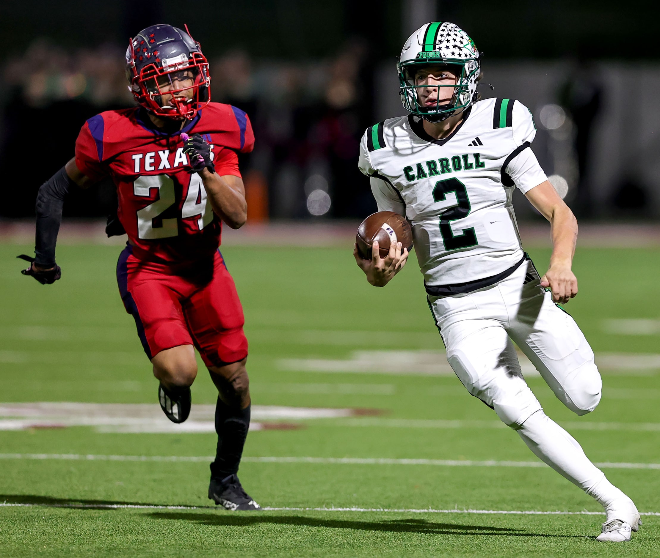 Southlake Carroll quarterback Angelo Renda (2) races past Justin Northwest defensive back...