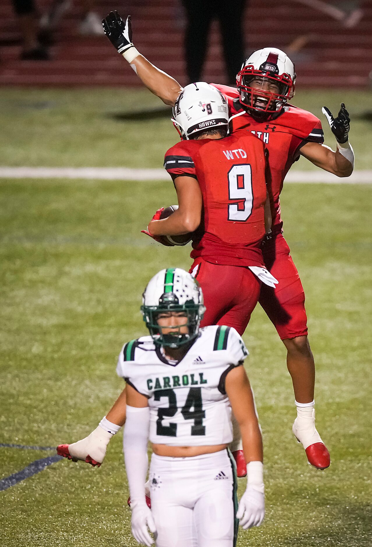 Rockwall-Heath wide receiver Fletcher Fierro celebrates with fellow wide receiver Jordan...