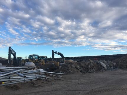 Construction crews are working to reinforce the existing border fence near El Paso.