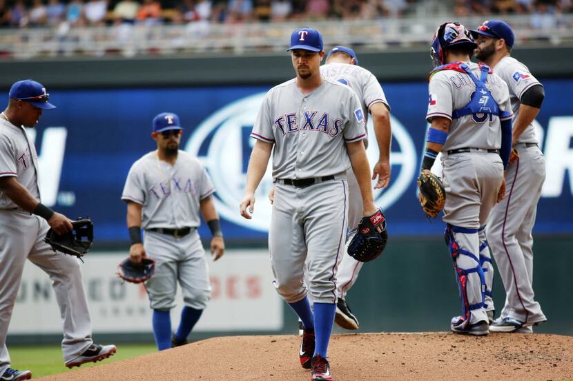 Texas Rangers pitcher Chi Chi Gonzalez leaves the mound after being pulled in the first...