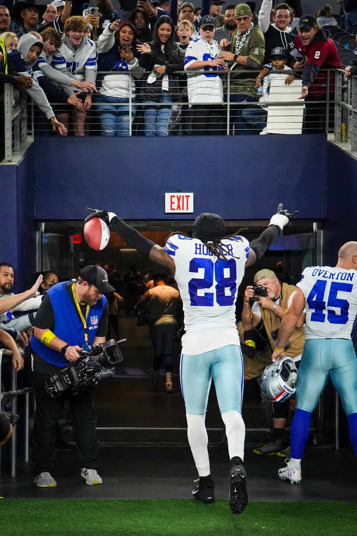 Dallas Cowboys safety Malik Hooker (28) motions to the crowd as he leaves the field after...