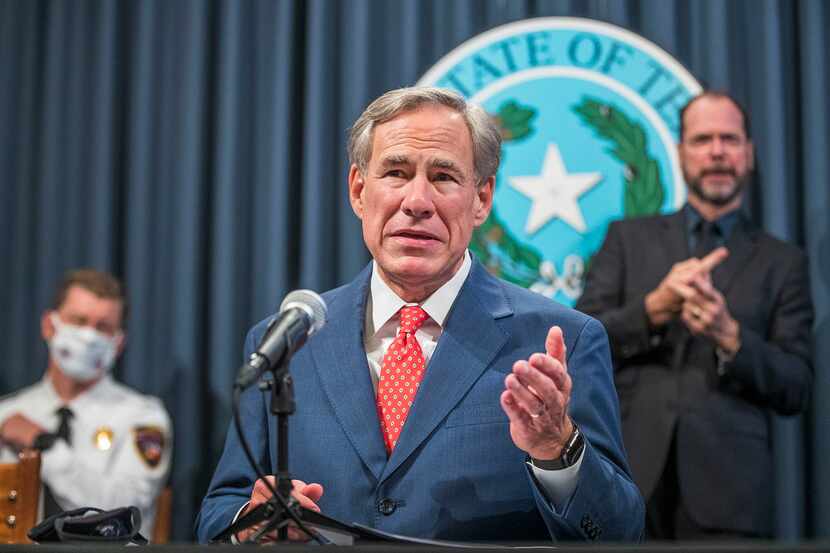 Gov. Greg Abbott, shown at a COVID-19 press conference from early last month, on Monday...