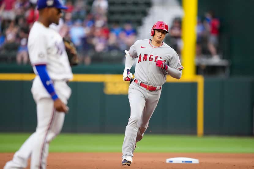 Los Angeles Angels designated hitter Shohei Ohtani runs the bases after hitting a lead off...