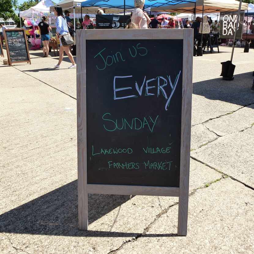 A sign last Sunday reminded shoppers to come back and visit Dallas'  newest farmers market,...
