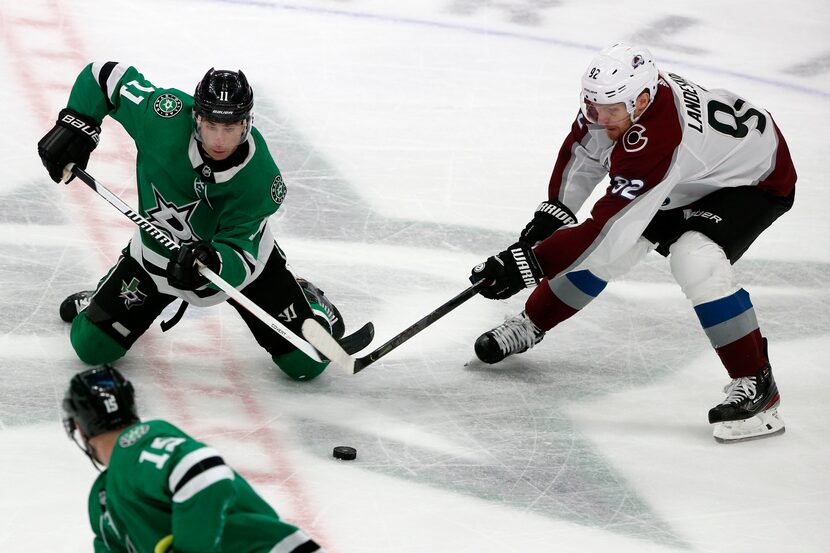 Dallas Stars center Andrew Cogliano (11) and Colorado Avalanche left wing Gabriel Landeskog...