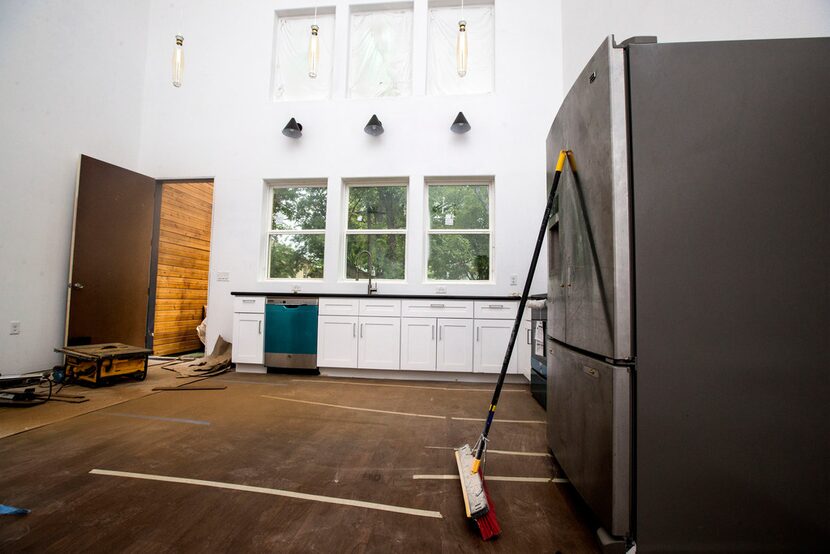 The kitchen area in the home of architect Jay Taylor, who built this house in Oak Cliff in...