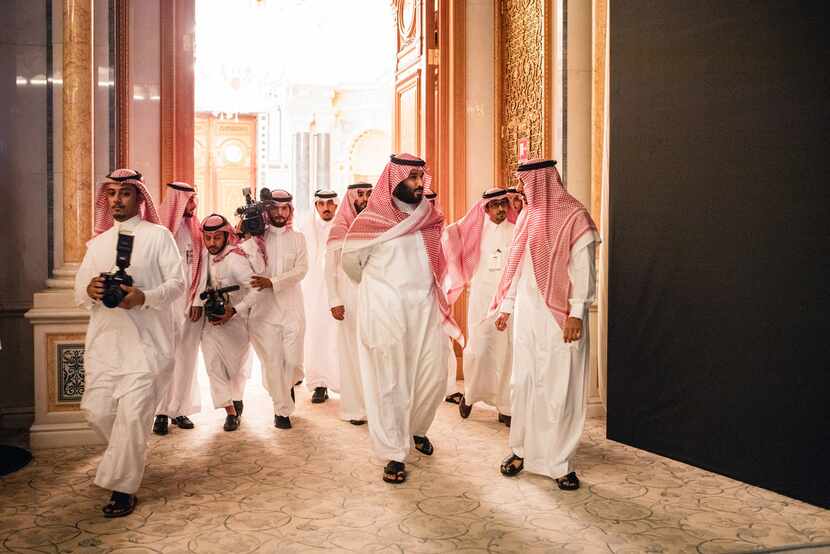 Trailed by his entourage, Crown Prince Mohammed bin Salman (center) arrived at a financial...