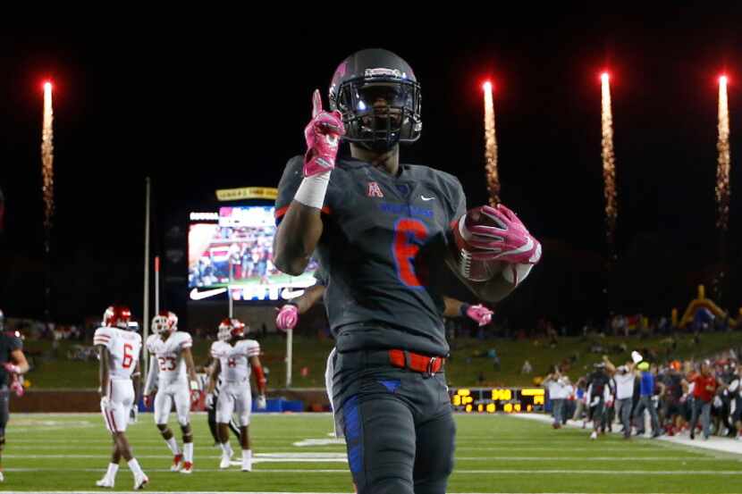 Southern Methodist running back Braeden West (6) scores a touchdown as the fireworks go off...