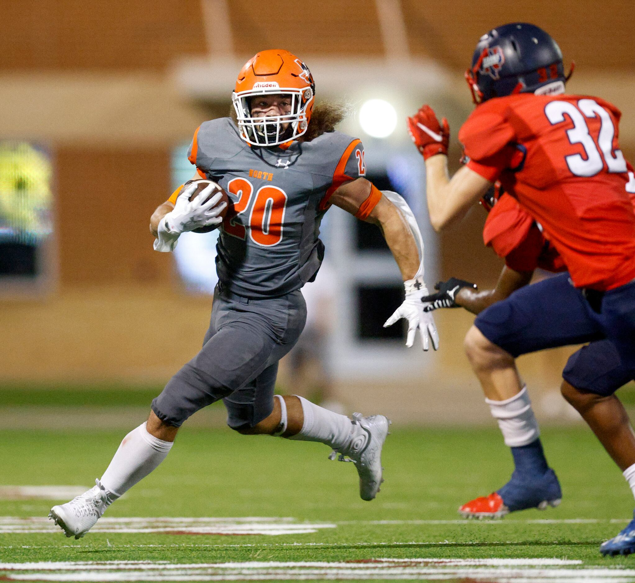 McKinney North Jalique Andrews (20) runs towards the sideline away from Justin Northwest...