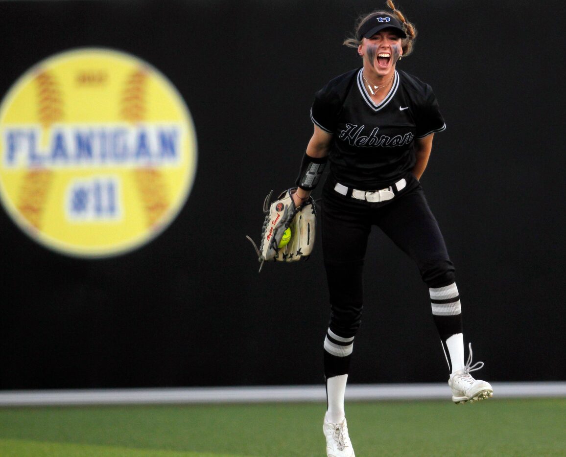 Hebron center fielder Alyssa Sneed reacts after making a diving catch during the bottom of...