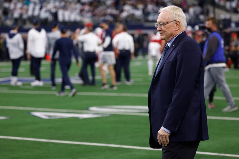 Dallas Cowboys owner Jerry Jones watches as the team warmups before a game between the...