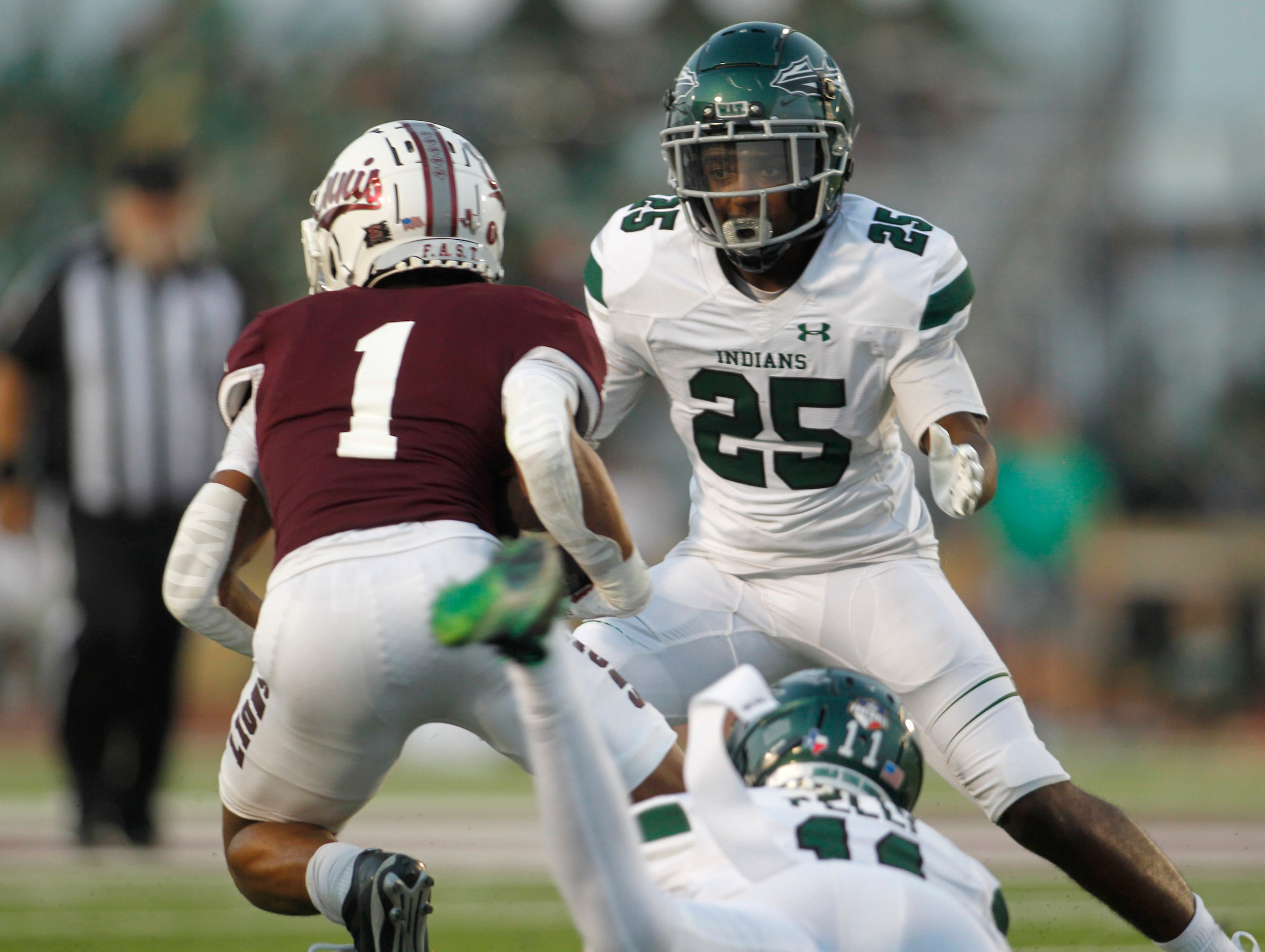 Waxahachie linebacker Darius Carrington (25) focuses on stopping Ennis receiver Gracen...